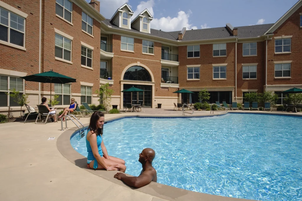 People relaxing by a pool | The village at Stetson Square in Corryville, Cincinnati, Ohio